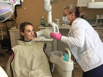 Woman receiving dental x-ray