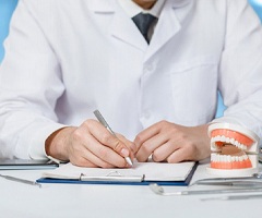 Writing treatment plan to help patient recover from dental emergency