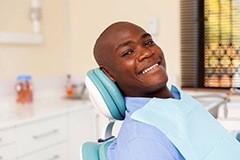 Smiling man in dental chair