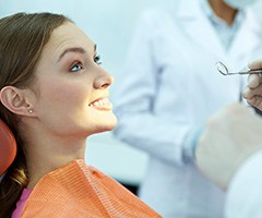 Smiling woman in dental chair