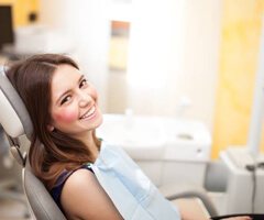 Smiling woman in dental chair