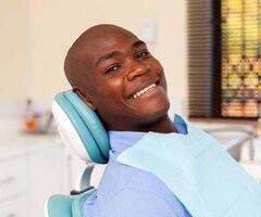 Smiling man in dental chair