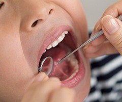 Child's smile during dental exam