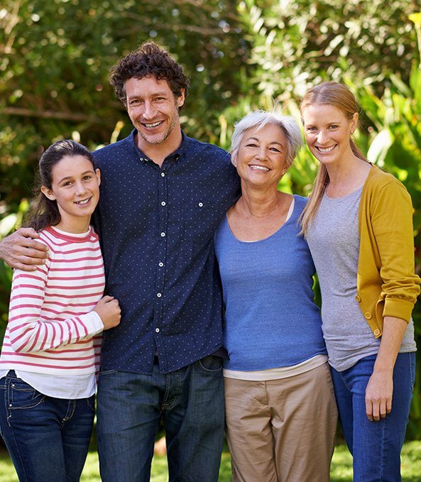 Family smiling together outdoors