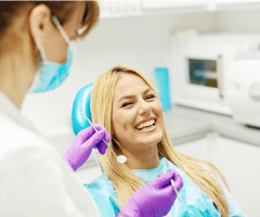 Laughing woman in dental chair