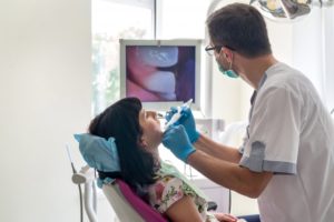 Dentist using an intraoral camera in Charlottesville during dental checkup